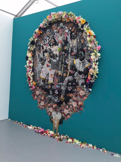 Ebony G. Patterson. Wi oh so clean. From the Family Series, Mixed media photo tapestry, with flowers. Installed at Untitled. Photograph: Jill Spalding.