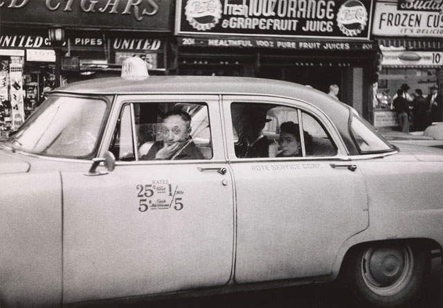 Diane Arbus. Taxicab driver at the wheel with two passengers, N.Y.C. 1956. © The Estate of Diane Arbus, LLC. All Rights Reserved.