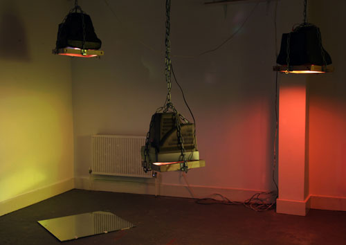 Toby Ross-Southall. Being Silent Isn't Strong (Installation View), 2010. DVD loop,  chain, wood, TVs, mirror, dimensions variable. © the artist.