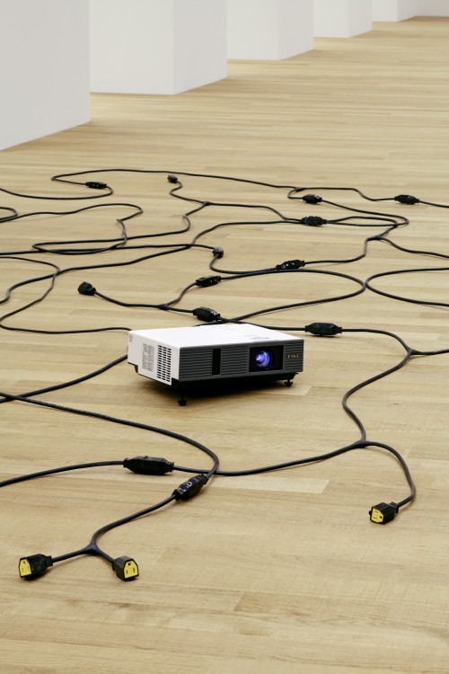 Paul Chan. Plow Highness, 2013. Cords and video projector with digital colour video, silent, 15.2 x 436.9 x 297.2 cm overall. Courtesy the artist and Greene Naftali, New York. © Paul Chan. Photograph: Tom Bisig, Basel.