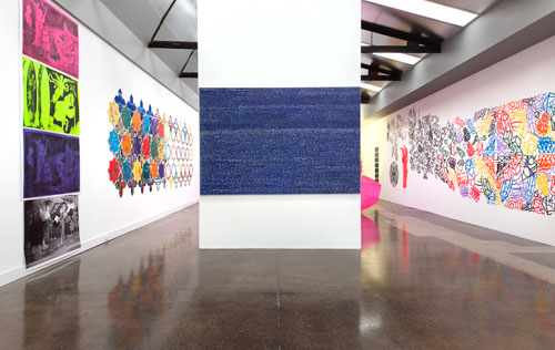 Irene Barberis. Installation view: Apocalypse/Revelation: Re Looking (Feminale; the edge of logic, intersecting luminosities).

Centre: Writings on the Wall (on canvas) #7, (Revelation Chapters 16 -22), 2012. Primed canvas, acrylic housepaint, white marker and chalk pen, 1.4 x 3 m.

Right: Cut it Out! Its a Wonderful World; Resurrection in Melbourne2012 (after Stanley Spencer), 2012. Laser cut acrylic with coloured mapping pins.

Photograph: Mark Ashkanasy.