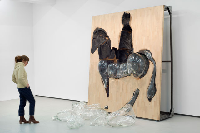 Titus Kaphar. Free Trade, 2016. Wood, blown glass, steel, seven blown glass components, charred wood sculpture, steel frame, 99 1/4 x 88 3/4 x 32 in, floor installation of six blown glass components, various dimensions. © Titus Kaphar. Courtesy of the artist and Jack Shainman Gallery.