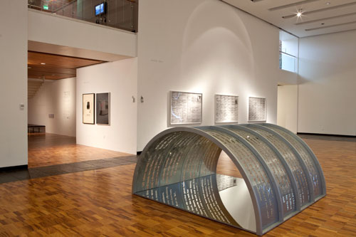 Mary Kelly and Ray Barrie. Foreground: <em>Habitus</em>, 2010. Laser cut acrylic, mirror and wood, 121.92 x 243.84 x 243.84 cm. Collection, the artist.