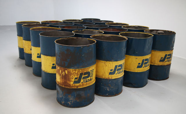Lydia Ourahmane. The Third Choir, 2014-15. 20 x Naftal Oil Barrels imported from Algeria, CZ-5HE Radio Transmitter, 20 x Samsung E2121B Phones. Installation view Ellis King, Dublin, 2015. Courtesy the artist.