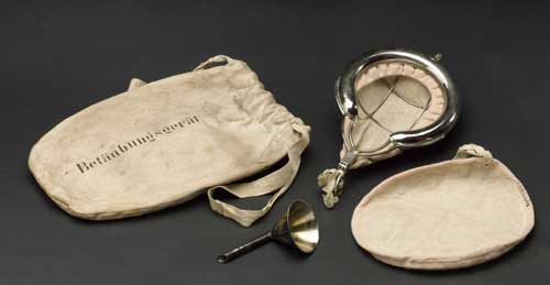 Cotton drawstring bag, containing facemask and funnel for inhaling ether. 
        Nickel plate and cotton, German, 1914-1918. The Science Museum