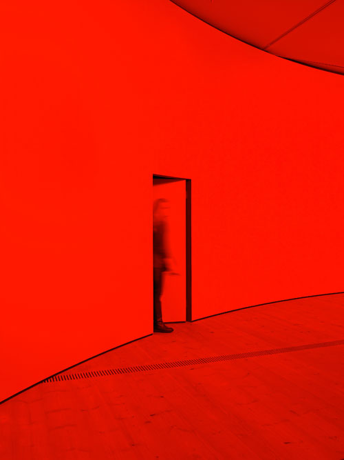 Gail Pickering. She was a Visitor, 2014. Installation view (2). Architectural installation incorporating cyclorama wall, red lights. Courtesy of the artist and BALTIC. © Gail Pickering. Photograph: John McKenzie.