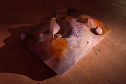 Samara Scott. Cabbage and clogs, 2014. Baking tray, tights, Sprite, cocktail glass, nail polish, food colouring, decorative sand. Courtesy of The Sunday Painter and the artist.