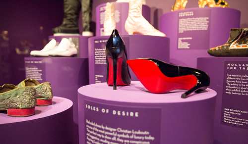Christian Louboutin 'Pigalle' pump. Installation view of Shoes: Pleasure and Pain. © Victoria and Albert Museum, London.